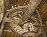 Mechanism transferring power from the wings to the millstone.