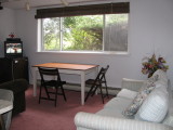 Living room with Sofa against wall.JPG