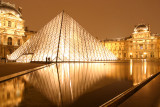 The Louvre at night.