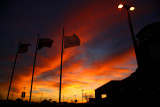 THREE FLAGS AT SUNSET