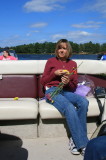 ME ON THE BOAT WITH FLOWERS TO THROW INTO THE WATER