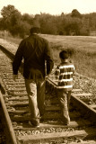 BROTHERS WALKING ON THE TRACKS
