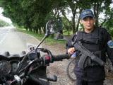Honduran police, a sweet Galil !  AK47s are reliable pieces of junk but check out the modified charging handle and mag release.