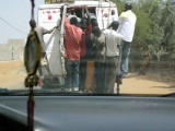 519 Overcrowded bus going about 40 MPH on rutted road.jpg