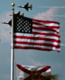 Quartet flying behind flags.jpg