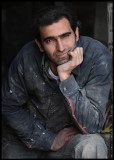 Taking av break - Young worker in Damascus old city