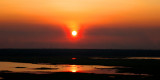 Smoke Haze. Sunset Over Wetlands.