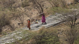 You can be carried to the top in one of these dholis. Here,a child is being carried down.