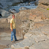 zP1060122 Man on rocks by MacDonald Creek in Glacier Naitonal Park.jpg