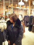 Trying on coats at the Overland Sheepskin Company in the Old Market
