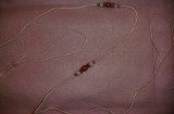 Lead 24-white ird. cord with white, silver, and red beads