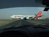 1703 25th August 08 Martinair crossing service road at Sharjah Airport.JPG