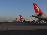 1657 12th December 07 Seven Air Arabia A320s on stand at Sharjah Airport.JPG