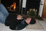 Brien naps in front of the fire