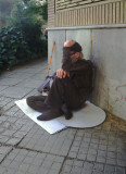 Another View of a Sitting Beggar