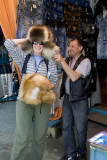Trying on a shapka or fur hat