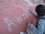 Our guide writes his name with sand so that we know what to yell if we get lost.
