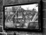 HM Coastguard Sign at Weymouth Harbour in Black and White