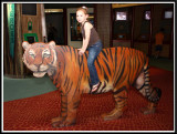 Noelle rides a tiger
