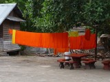 Monks robes drying, back street Luang Prabang