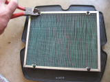 I cut the bottom screen off and old air filter
