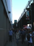 Fans walking by the ell toward the stadium entrances
