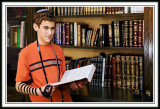 Wearing Tfillin, Josh Prepares for his Bar Mitzvah