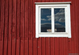 White window on a red wall