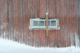 A barn window in the winter