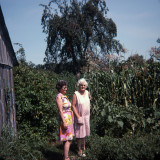 Mom and Granny in the garden by the old chicken house.