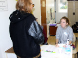 Chico High School student and Shalom Free Clinic greeter welcomes a patient