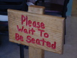 Please wait to be seated