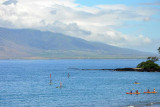 We paddle beyond the reef