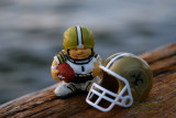 New Orleans Saints Huddles figure and micro helmet on the banks of the Mighty Mississippi