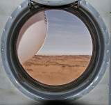 Porthole framed with fuel tank