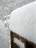 An impressive pile of snow on the railing