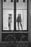 Two mannequins and a bicycle