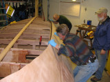 Guiding drywall screws into registration holes.