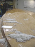 Lots of scrapings. Scraping works better than sanding on soft resin.