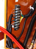 Pump wiring at terminal block inside helm above floorboards, for ease of replacement.  Butt connectors drier but harder to servi