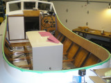 Coaming and inside of hull masked for painting.