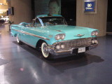 One of the many vintage cars on the groud floor of the building
