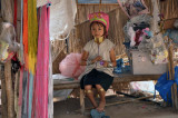 A young Karen tribe girl busy doing her daily chores