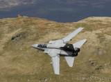 Aircraft photographer in orange at the Mach Loop Wales