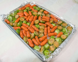 Brussel sprouts with baby carrots before baking at 350