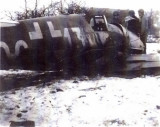 Another shot showing GIs looking at the bent propeller