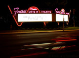 Route 66 Drive-In Sign with Car Lights