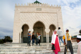 Hundreds of Moroccans come every day to honor to the deceased king who lies entombed in the white onyx.