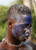 Voodoo. Another man in trance, here also blue powder is put in the face.
