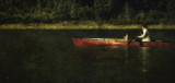 red canoe at daybreak